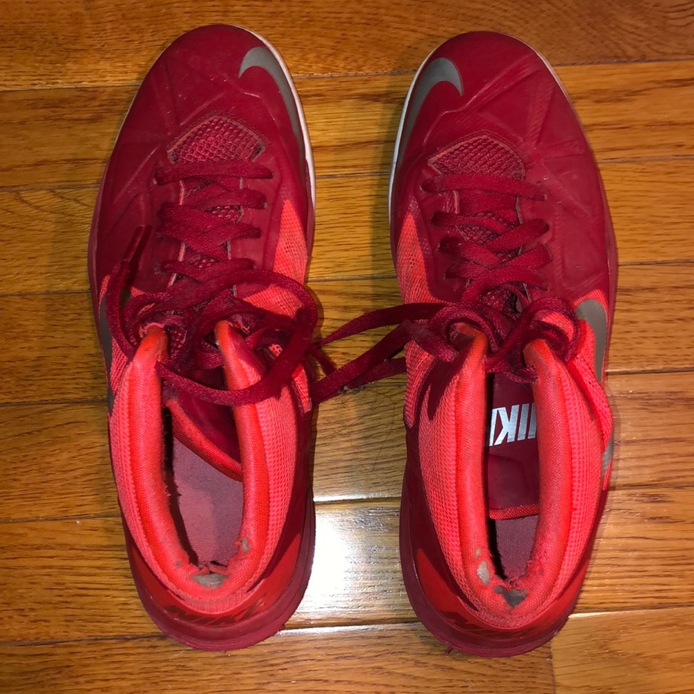 Red Nike high top basketball shoes